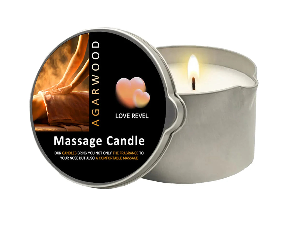 Massage candle with a lit candle inside a metallic tin on a white background