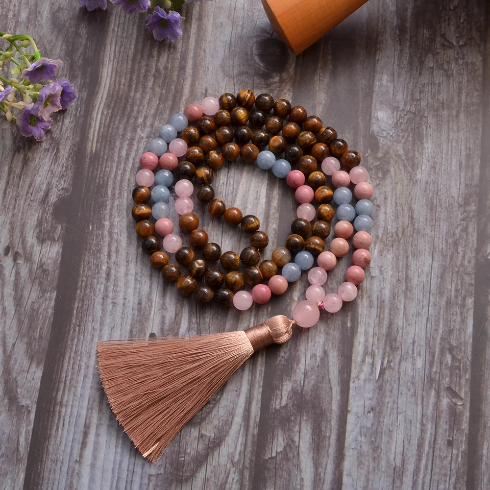 Colorful beaded necklace with a tassel on a wooden surface