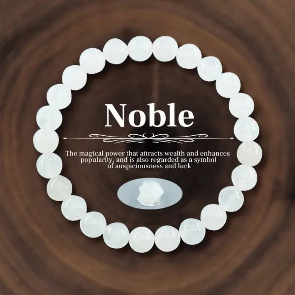 White beaded bracelet with 'Noble' text on a dark brown background