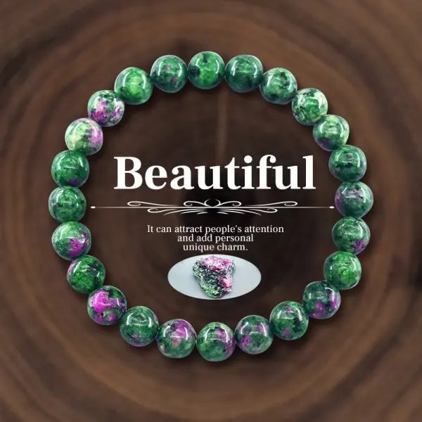 Green and purple beaded bracelet on a wooden background with text 'Beautiful'.