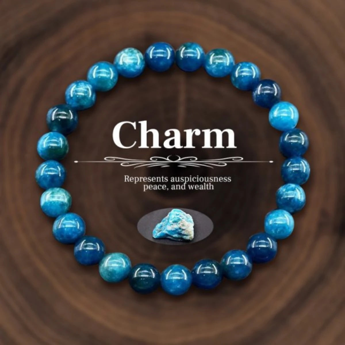 Blue beaded bracelet with a central stone on a wooden background, labeled 'Charm'.