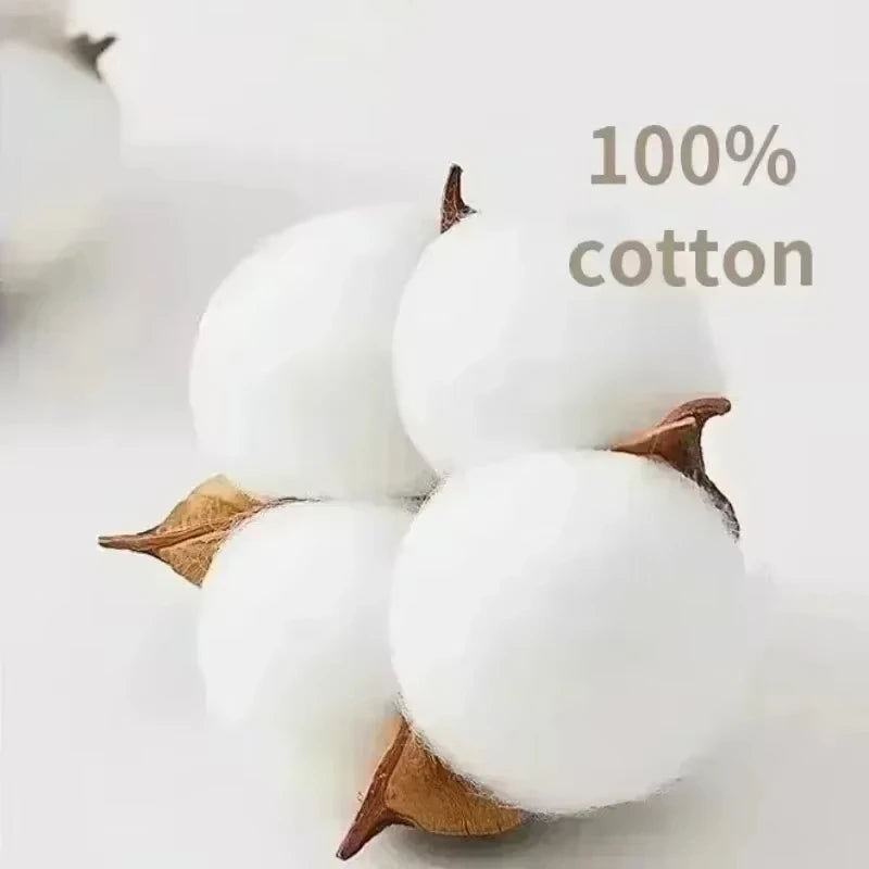Close-up of cotton bolls with '100% cotton' text on a light background