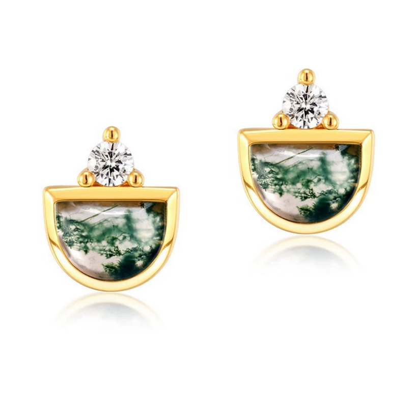 Gold earrings with green stone and clear gem on a white background