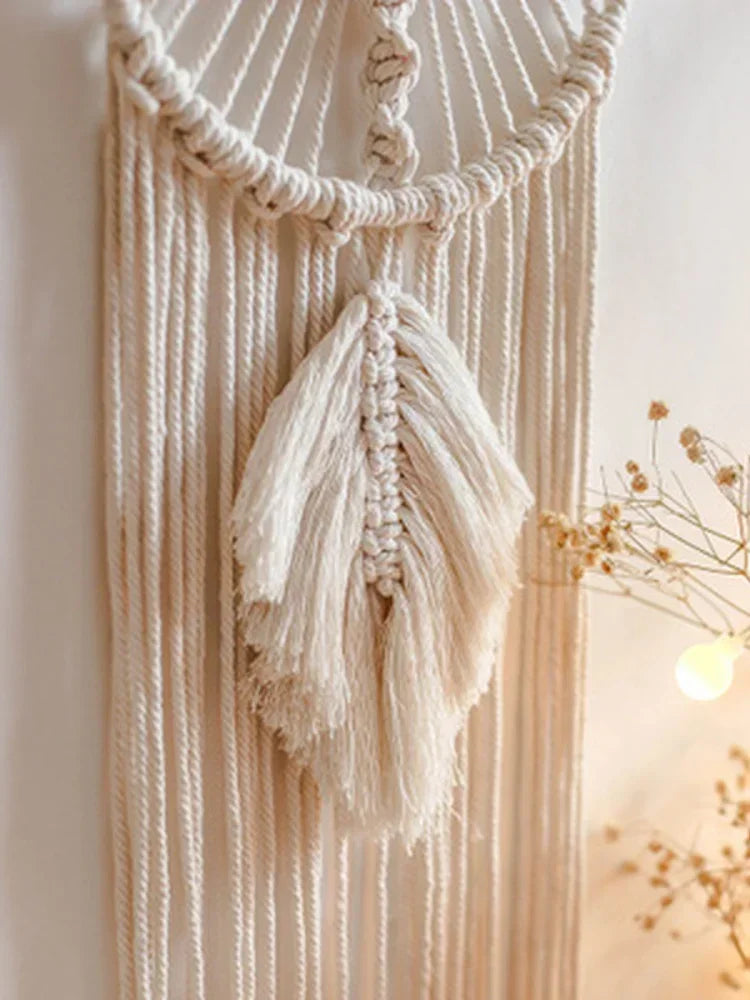 Macrame wall hanging with natural fibers on a light background